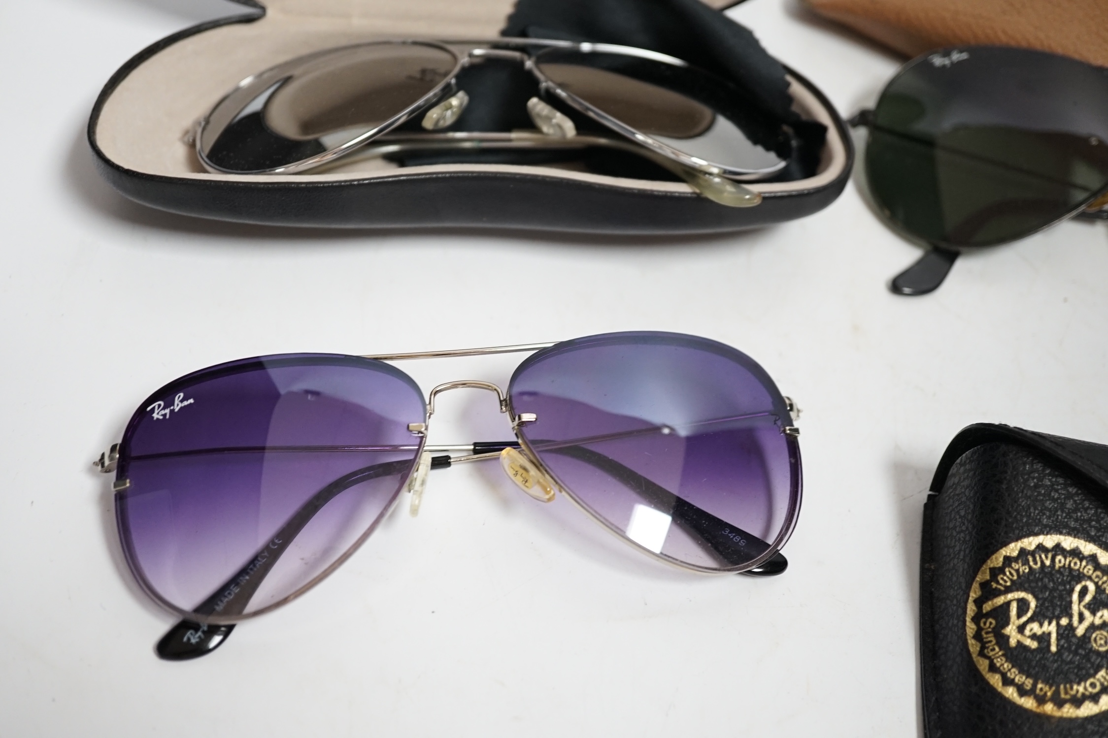 A collection of vintage Ray-Bans and other sunglasses